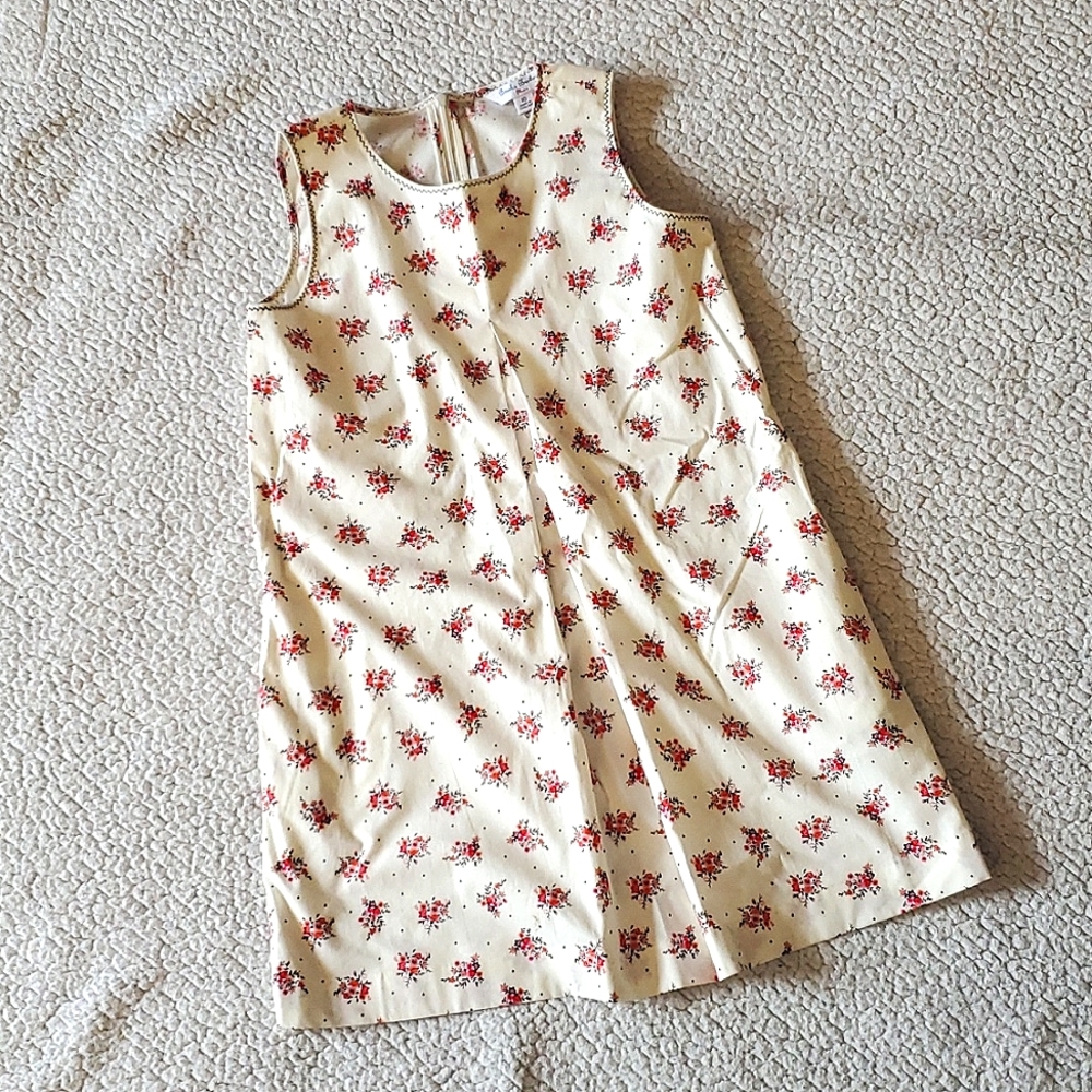 Never worn. Tags lost. Brooks Brothers dress. Size 10. Color ivory.
